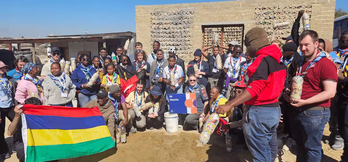 Scouts International volunteers making eco-bricks